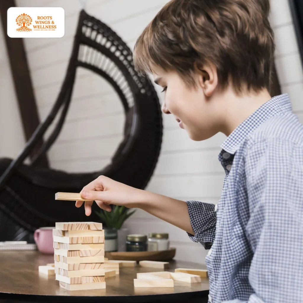 10 Best Play Activities for Child Brain Development 2 Child playing with building blocks for cognitive development.