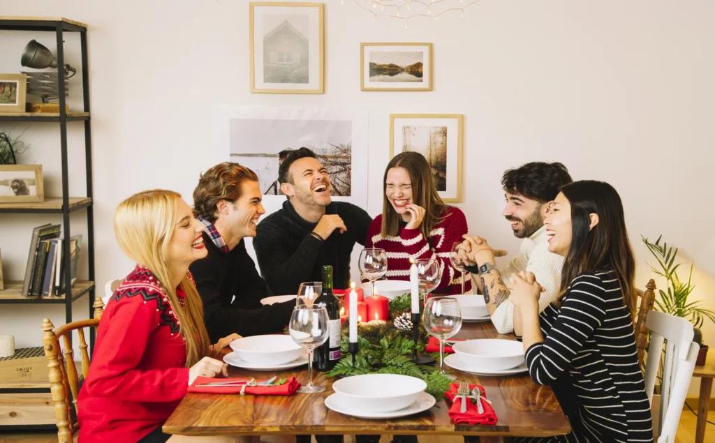 A happy family enjoying a screen-free dinner, fostering presence and connection.